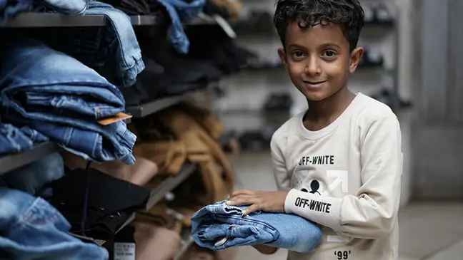Image: A child in Yemen buys his new Eid clothes as part of our Eid Gifts programme. Islamic Relief Singapore