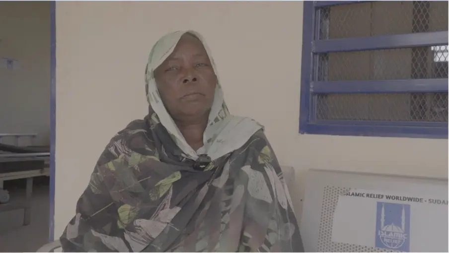 A patient waits for medical care in one of Sudan’s overwhelmed hospitals, where shortages of staff, supplies, and space leave many struggling to access treatment