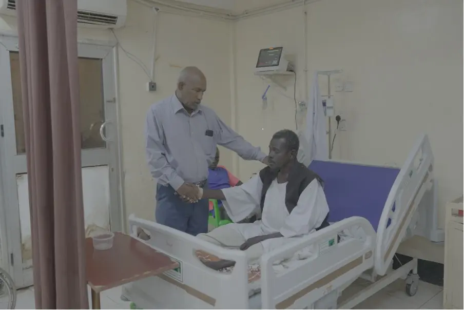 Head of Al Ameen Hospital, Dr. Abdalbasit Alameen, visits patients in one of Sudan’s many overstretched hospitals