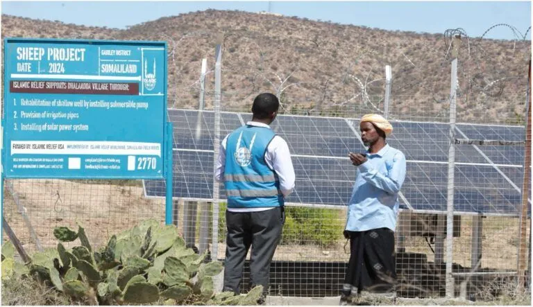 Mukhtar stands beside the newly-installed solar power system in Dhalladda village, Gabiley, reflecting on how clean energy has transformed daily life. Islamic Relief -Ahmed Jama