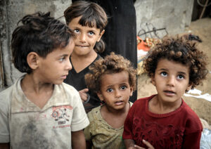 A group of children look up at camera
